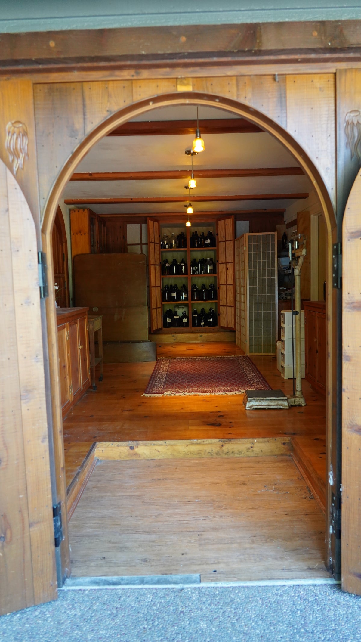 A view of an open door with the Omica  Wellness Apothecary.